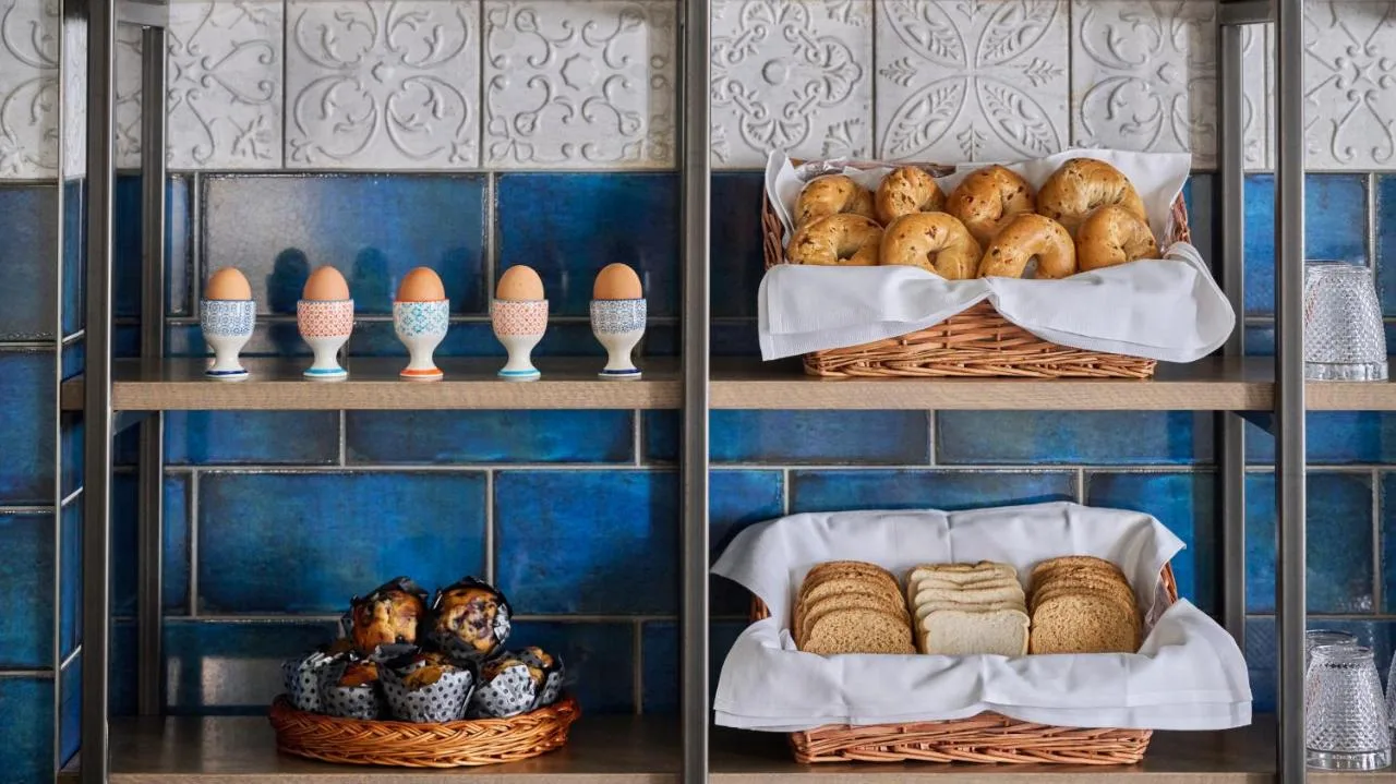 two shelves with baskets of bread and eggs at Fraser Suites Glasgow in Glasgow